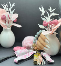 Load image into Gallery viewer, Set of 9 light pink marble acrylic keychains with gold rings, arranged in a soft pastel aesthetic. Perfect for teen accessories and gifting.