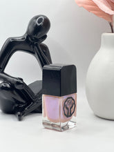 Load image into Gallery viewer, Soft pink shimmer nail polish on medium brown skin