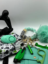 Load image into Gallery viewer, Bundle of 9 teal marble acrylic keychains with gold hardware, arranged in a cool-toned flat lay. Ideal for aesthetic teen accessories and gifting.